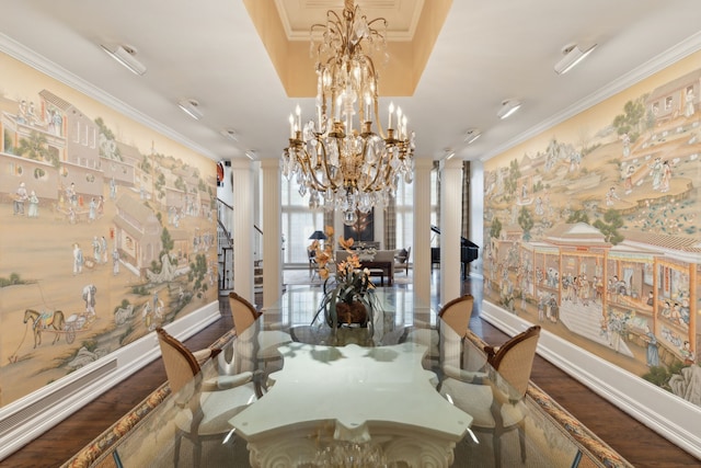 dining area featuring crown molding, wood finished floors, and ornate columns