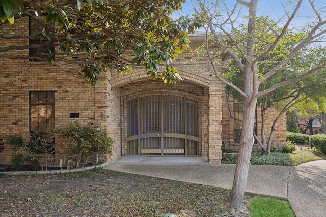 exterior space featuring brick siding