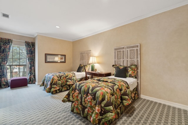 bedroom featuring baseboards, visible vents, crown molding, and carpet flooring