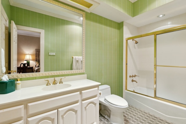 bathroom featuring wallpapered walls, bath / shower combo with glass door, toilet, and vanity