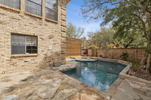 view of pool with a fenced backyard, a fenced in pool, and a patio