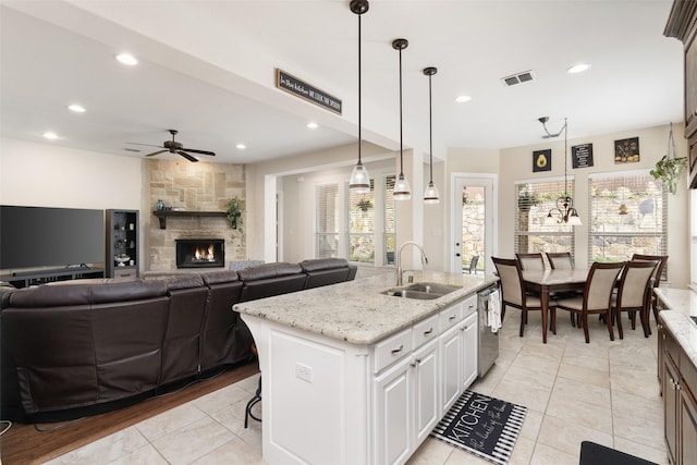 kitchen featuring a sink, dishwasher, ceiling fan, a healthy amount of sunlight, and visible vents