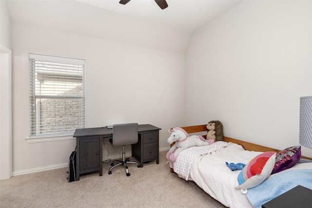 bedroom with light colored carpet, vaulted ceiling, and baseboards