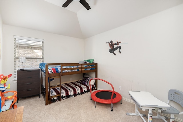 carpeted bedroom featuring vaulted ceiling and a ceiling fan