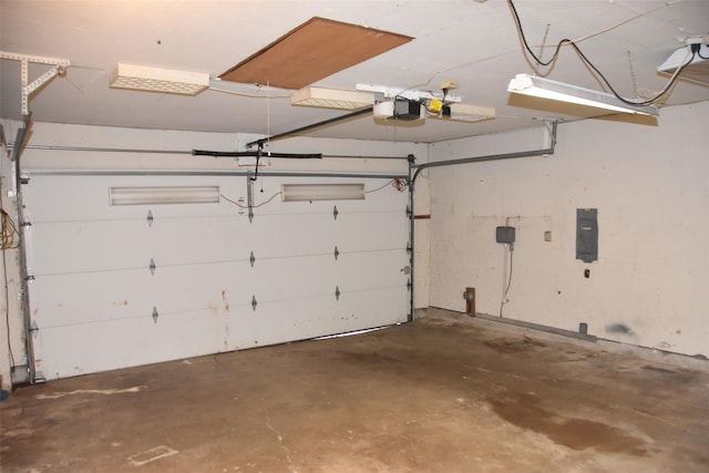 312 E Tripp Rd, Sunnyvale, TX 75182 - garage with a garage door opener and electric panel