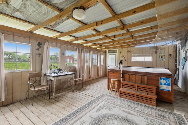 sunroom featuring a hot tub