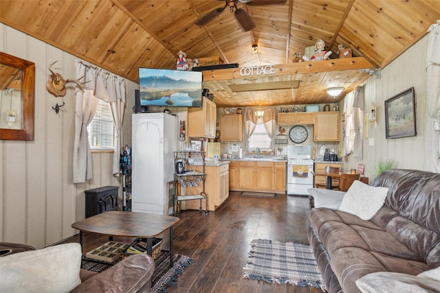 living area featuring wood walls, lofted ceiling, dark wood-type flooring, wood ceiling, and a ceiling fan