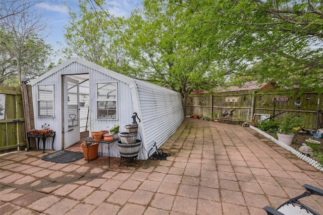 view of outdoor structure with an outbuilding and a fenced backyard