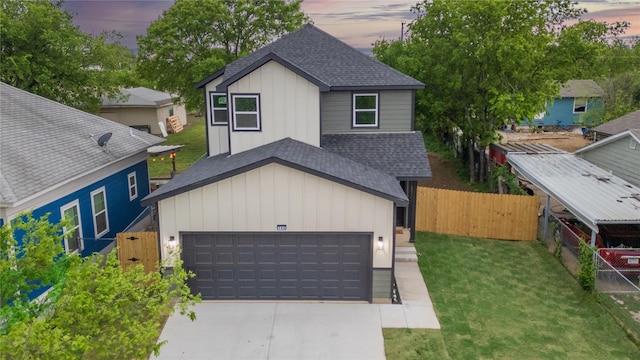 view of front facade with concrete driveway, roof with shingles, fence, and board and batten siding