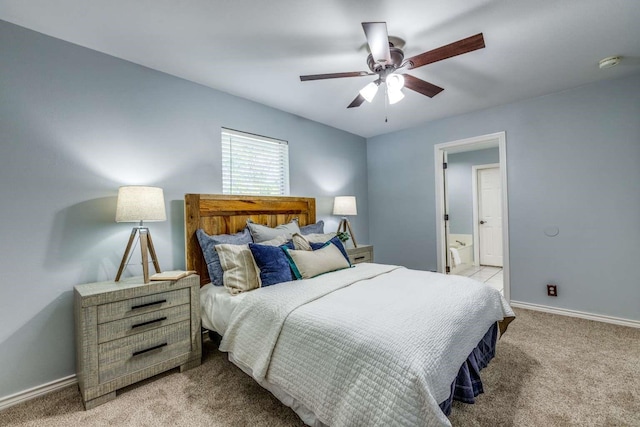 845 County Road 490, Princeton, TX 75407 - bedroom featuring light carpet, baseboards, ceiling fan, and ensuite bathroom