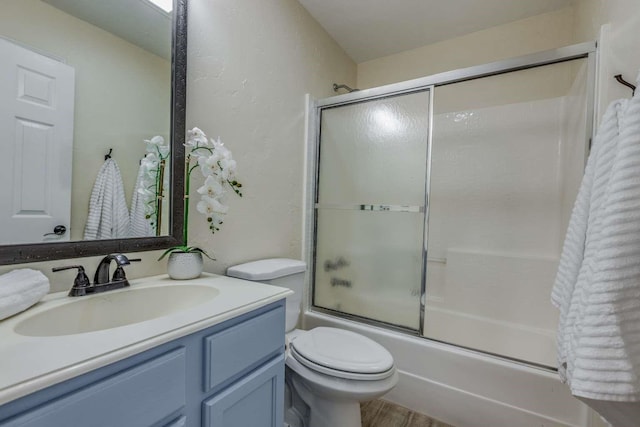 845 County Road 490, Princeton, TX 75407 - full bathroom with combined bath / shower with glass door, wood finished floors, toilet, and vanity