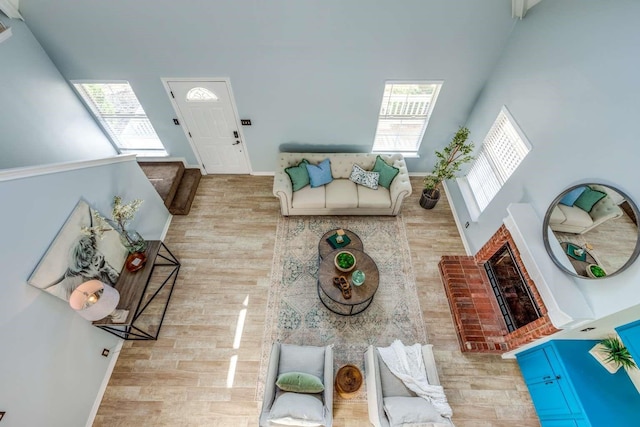 845 County Road 490, Princeton, TX 75407 - living room featuring a high ceiling, wood finished floors, and a healthy amount of sunlight