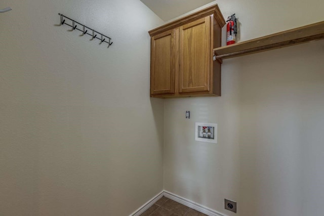 845 County Road 490, Princeton, TX 75407 - laundry room with hookup for a washing machine, baseboards, dark tile patterned flooring, electric dryer hookup, and cabinet space