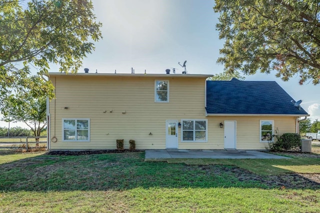 845 County Road 490, Princeton, TX 75407 - back of property featuring fence, a patio area, and a lawn