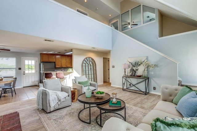 845 County Road 490, Princeton, TX 75407 - living area with light wood-type flooring, a ceiling fan, and visible vents