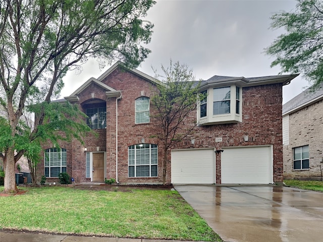 4808 Winterview Dr, Mansfield, TX 76063 - view of front facade with driveway, an attached garage, brick siding, and a front yard