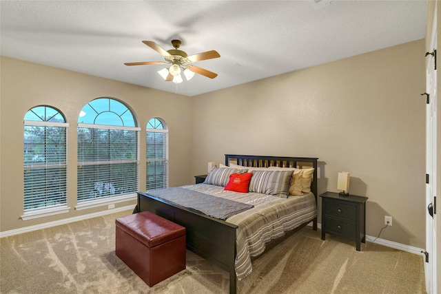 bedroom featuring baseboards, carpet, and ceiling fan