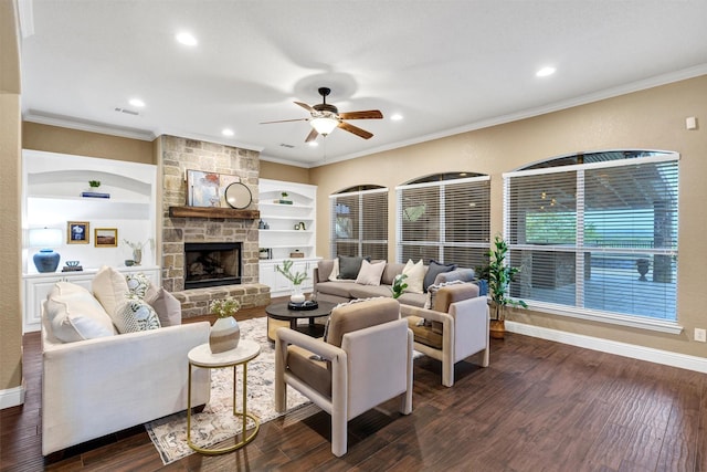 living room with a ceiling fan, dark wood-style floors, recessed lighting, and a stone fireplace