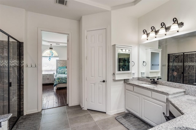12532 Princess Dr, Frisco, TX 75035 - full bathroom with vanity, a shower stall, tile patterned floors, ensuite bathroom, and baseboards