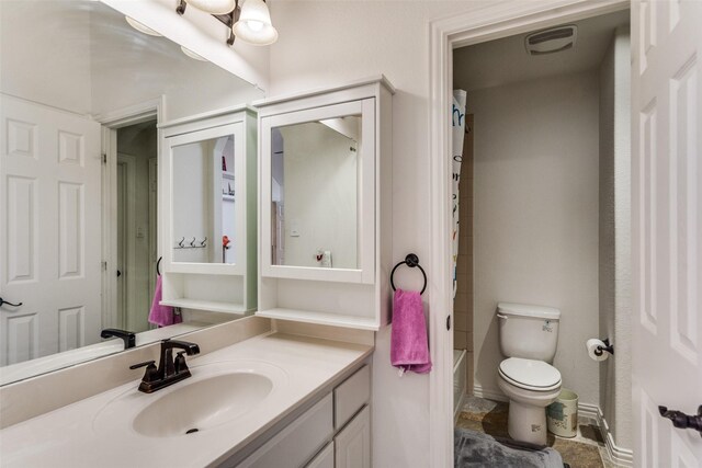 12532 Princess Dr, Frisco, TX 75035 - bathroom with vanity, toilet, and baseboards