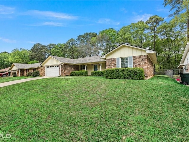 single story home featuring board and batten siding, brick siding, a front yard, and a garage
