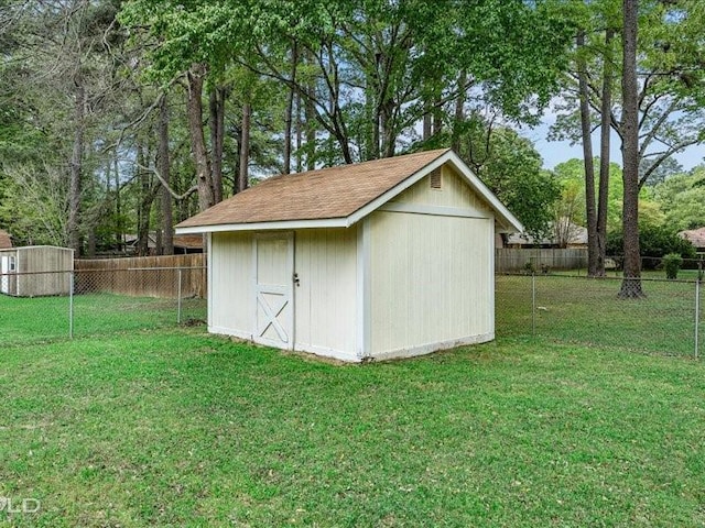 view of shed featuring a fenced backyard