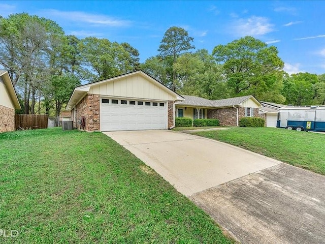 ranch-style home featuring driveway, a front yard, fence, an attached garage, and brick siding