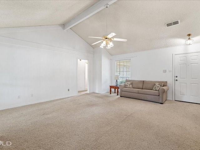 carpeted living area with a textured ceiling, ceiling fan, visible vents, and vaulted ceiling with beams