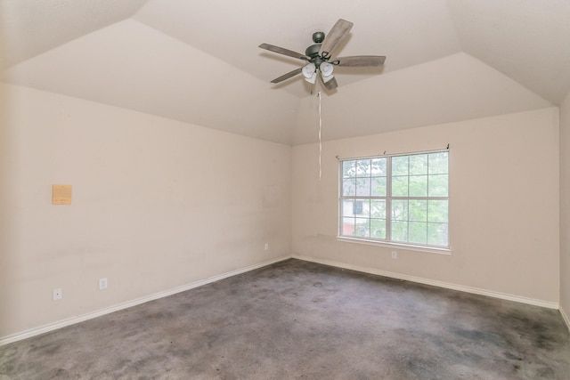 spare room with baseboards, a ceiling fan, carpet floors, and lofted ceiling