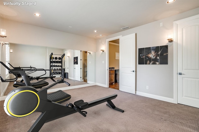 exercise area featuring baseboards, visible vents, recessed lighting, and carpet