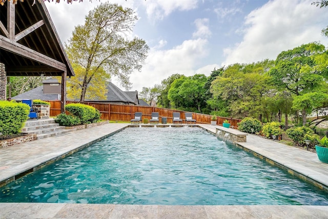 view of swimming pool featuring a patio, a fenced in pool, and a fenced backyard