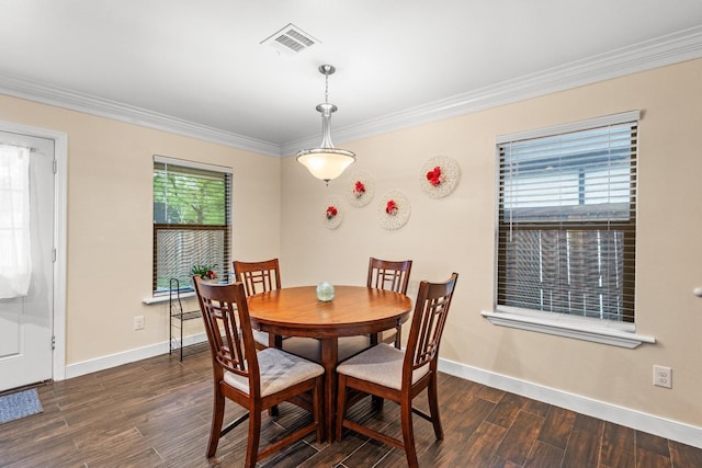 1321 S Montgomery St, Sherman, TX 75090 - dining space with crown molding, dark wood finished floors, and baseboards