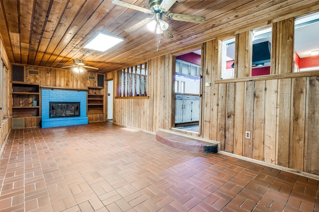 302 Comanche Dr, Gainesville, TX 76240 - interior space with wood walls, a ceiling fan, and brick floor