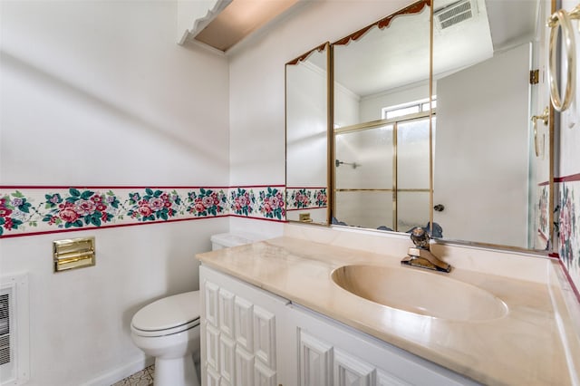 302 Comanche Dr, Gainesville, TX 76240 - bathroom with visible vents, a stall shower, toilet, and vanity