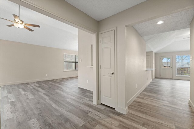 1581 Glenmore Dr, Lewisville, TX 75077 - interior space with lofted ceiling, baseboards, wood finished floors, and a healthy amount of sunlight
