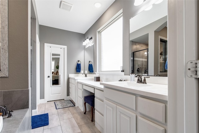 813 Pier St, Little Elm, TX 76227 - bathroom with a shower stall, double vanity, and a bath