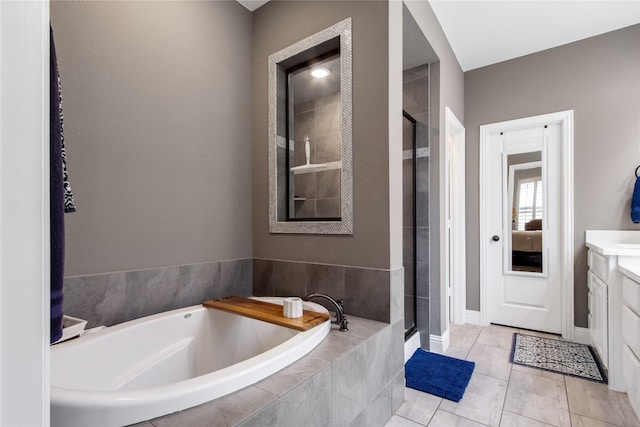 813 Pier St, Little Elm, TX 76227 - full bathroom with a stall shower, vanity, a garden tub, and baseboards