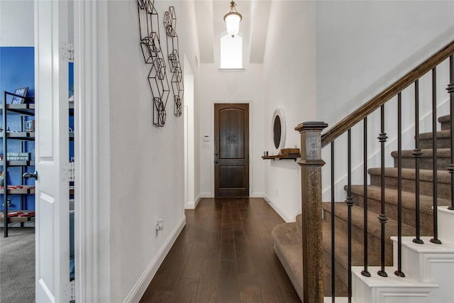 813 Pier St, Little Elm, TX 76227 - foyer with stairs, dark wood-type flooring, a towering ceiling, and baseboards