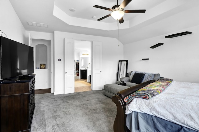 14649 Martin Creek Cv, Fort Worth, TX 76262 - carpeted bedroom with a tray ceiling, a ceiling fan, ensuite bathroom, and baseboards