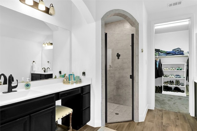 14649 Martin Creek Cv, Fort Worth, TX 76262 - full bath with a walk in closet, vanity, wood finished floors, and a shower stall
