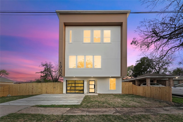 1902 Homeland St, Dallas, TX 75212 - modern home with a garage, driveway, stucco siding, and fence