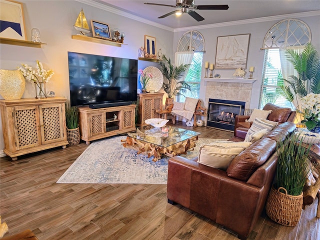 4805 Saddleback Ln, Wichita Falls, TX 73608 - living area featuring plenty of natural light, a tile fireplace, a ceiling fan, ornamental molding, and wood finished floors
