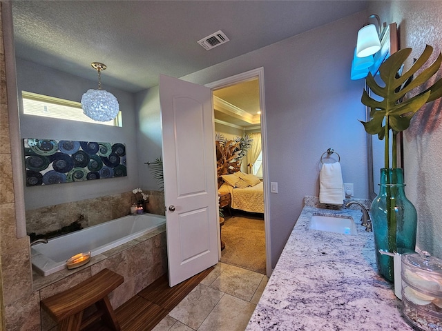 4805 Saddleback Ln, Wichita Falls, TX 73608 - ensuite bathroom featuring a sink, tile patterned flooring, and a bath