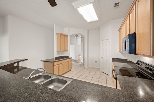 8329 Rolling Rock Dr, Fort Worth, TX 76123 - kitchen with a ceiling fan, black range with electric cooktop, dark countertops, a sink, and light tile patterned floors