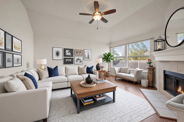 8329 Rolling Rock Dr, Fort Worth, TX 76123 - living room with ceiling fan, wood finished floors, vaulted ceiling, and a fireplace
