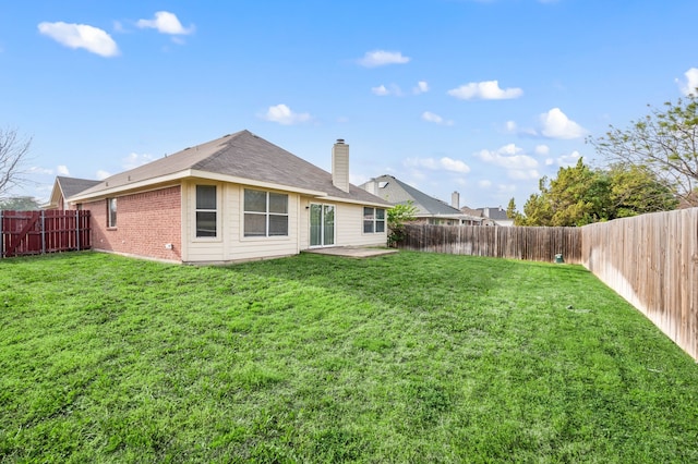 8329 Rolling Rock Dr, Fort Worth, TX 76123 - rear view of property with a yard, brick siding, a patio, and a fenced backyard