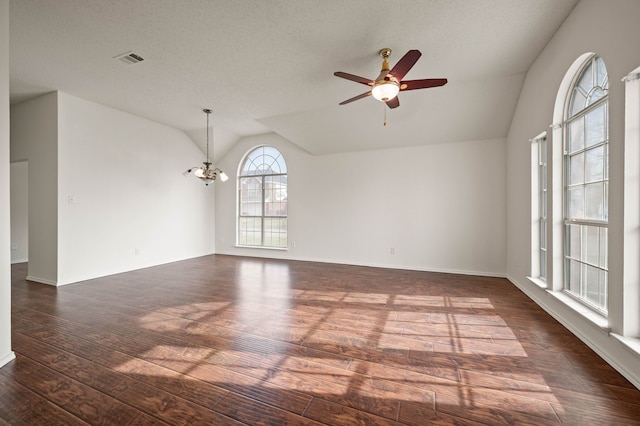 8329 Rolling Rock Dr, Fort Worth, TX 76123 - unfurnished room featuring visible vents, baseboards, dark wood-style floors, ceiling fan with notable chandelier, and vaulted ceiling