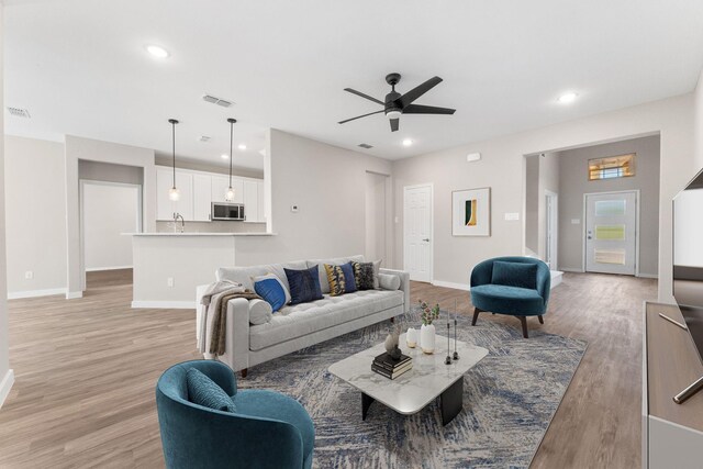 3504 Keyridge Dr, Dallas, TX 75241 - unfurnished living room with ceiling fan, light wood-style flooring, baseboards, and recessed lighting