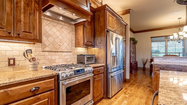 169 Star Point Ln, Weatherford, TX 76088 - kitchen with crown molding, light stone countertops, exhaust hood, stainless steel appliances, and decorative backsplash