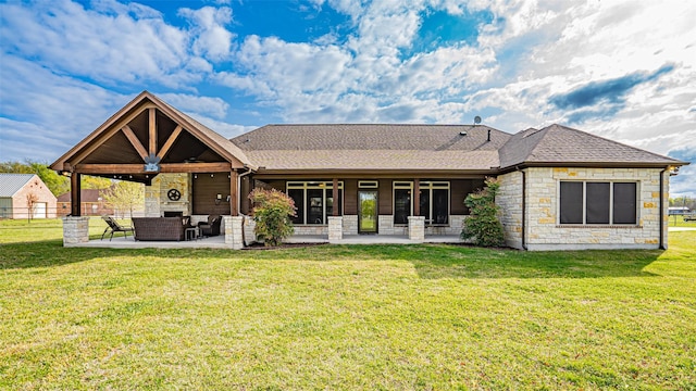 169 Star Point Ln, Weatherford, TX 76088 - back of house with stone siding, a yard, outdoor lounge area, and a patio area